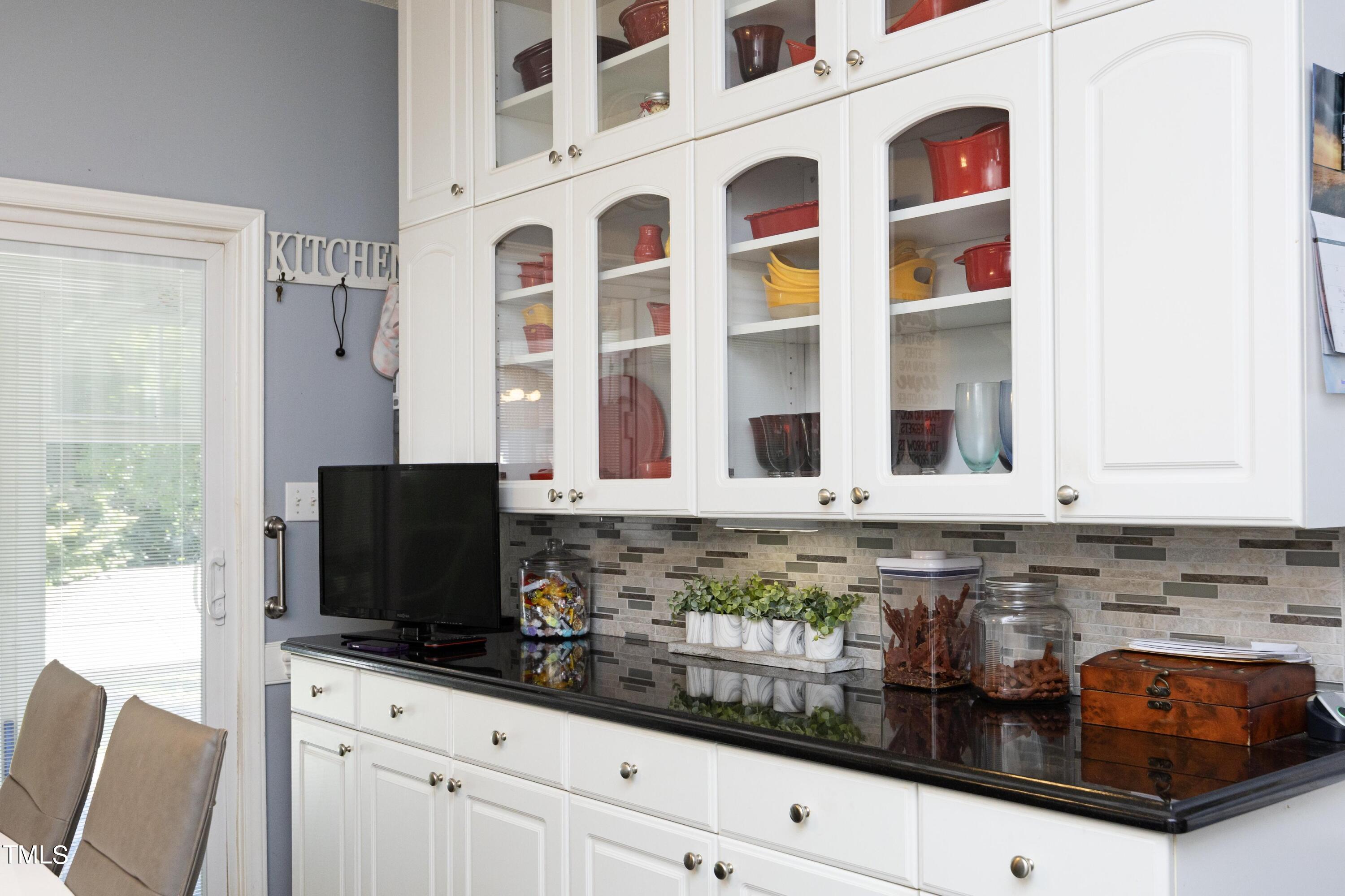 243 Bradley Drive Benson, NC 27504 - Photo 12 of 43 a kitchen with stainless steel appliances granite countertop a stove and a microwave