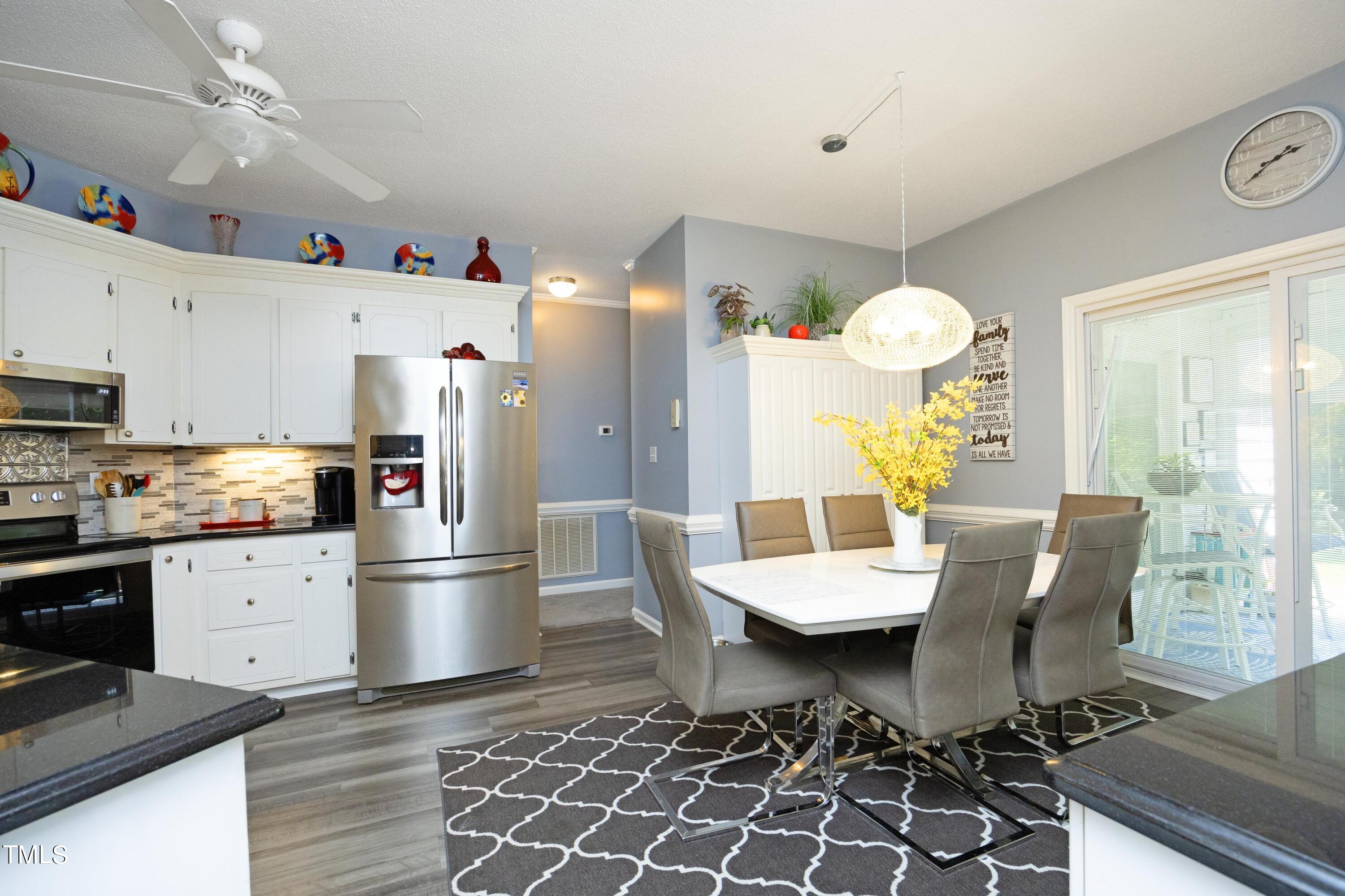 243 Bradley Drive Benson, NC 27504 - Photo 13 of 43 a living room with dining room and wooden floor