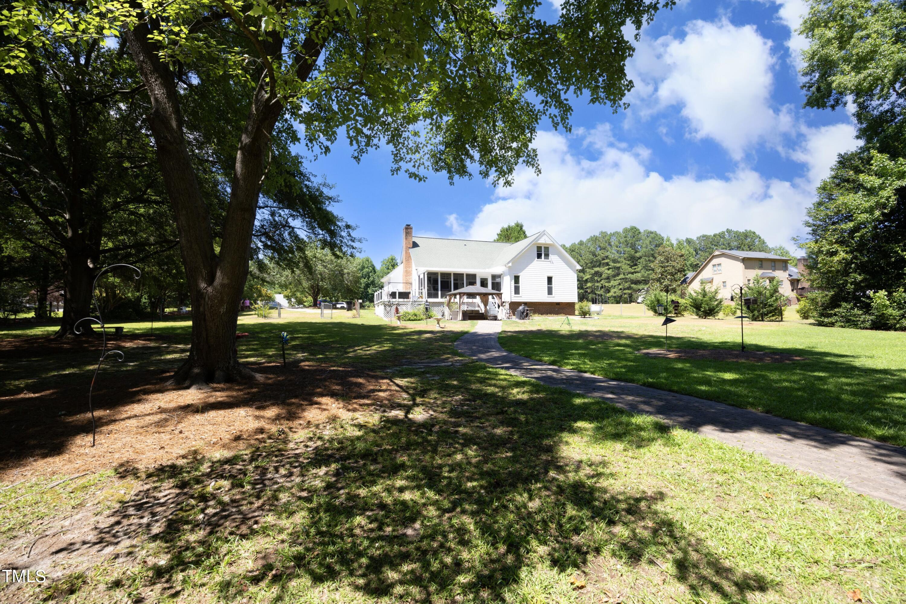 243 Bradley Drive Benson, NC 27504 - Photo 30 of 43 a front view of a house with a yard