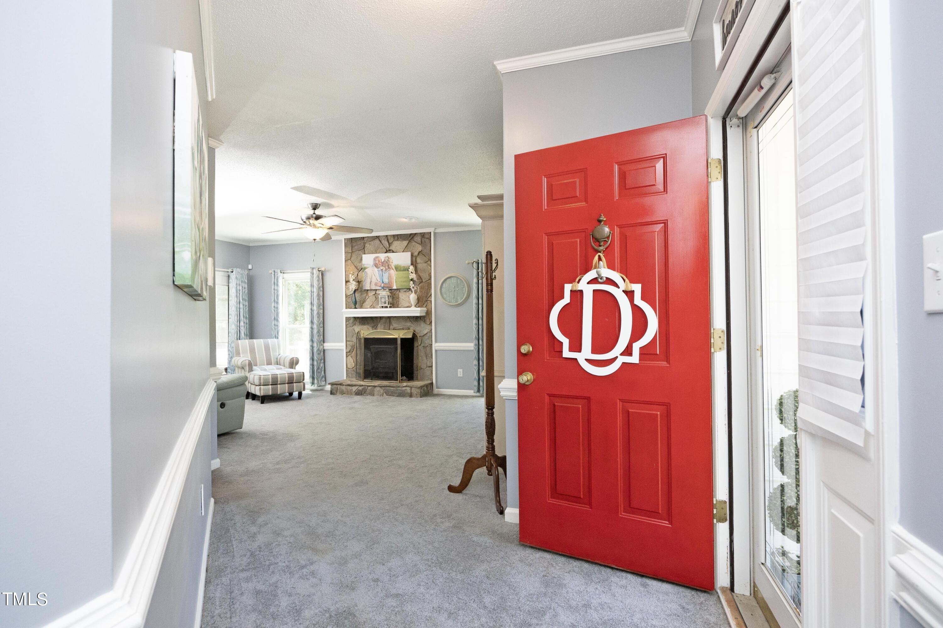 243 Bradley Drive Benson, NC 27504 - Photo 3 of 43 a view of an entryway with wooden floor