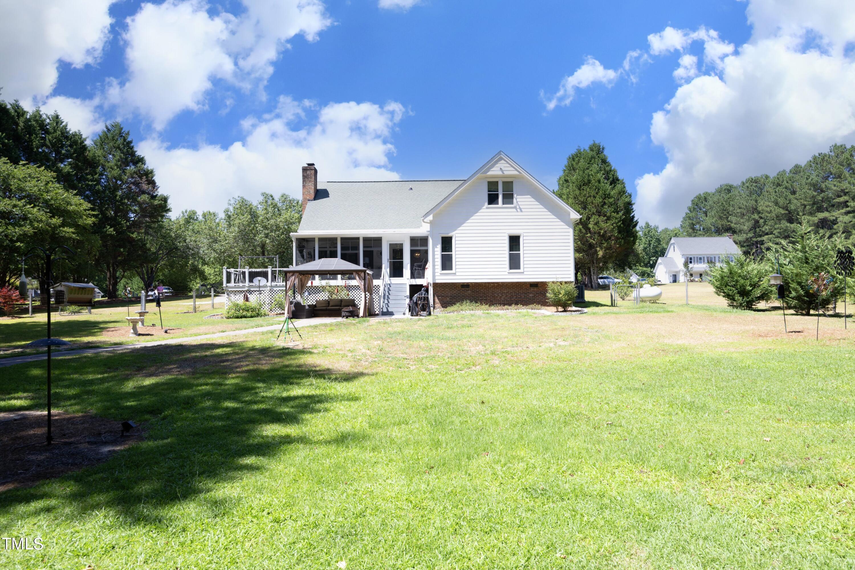 243 Bradley Drive Benson, NC 27504 - Photo 31 of 43 a view of a house with a big yard