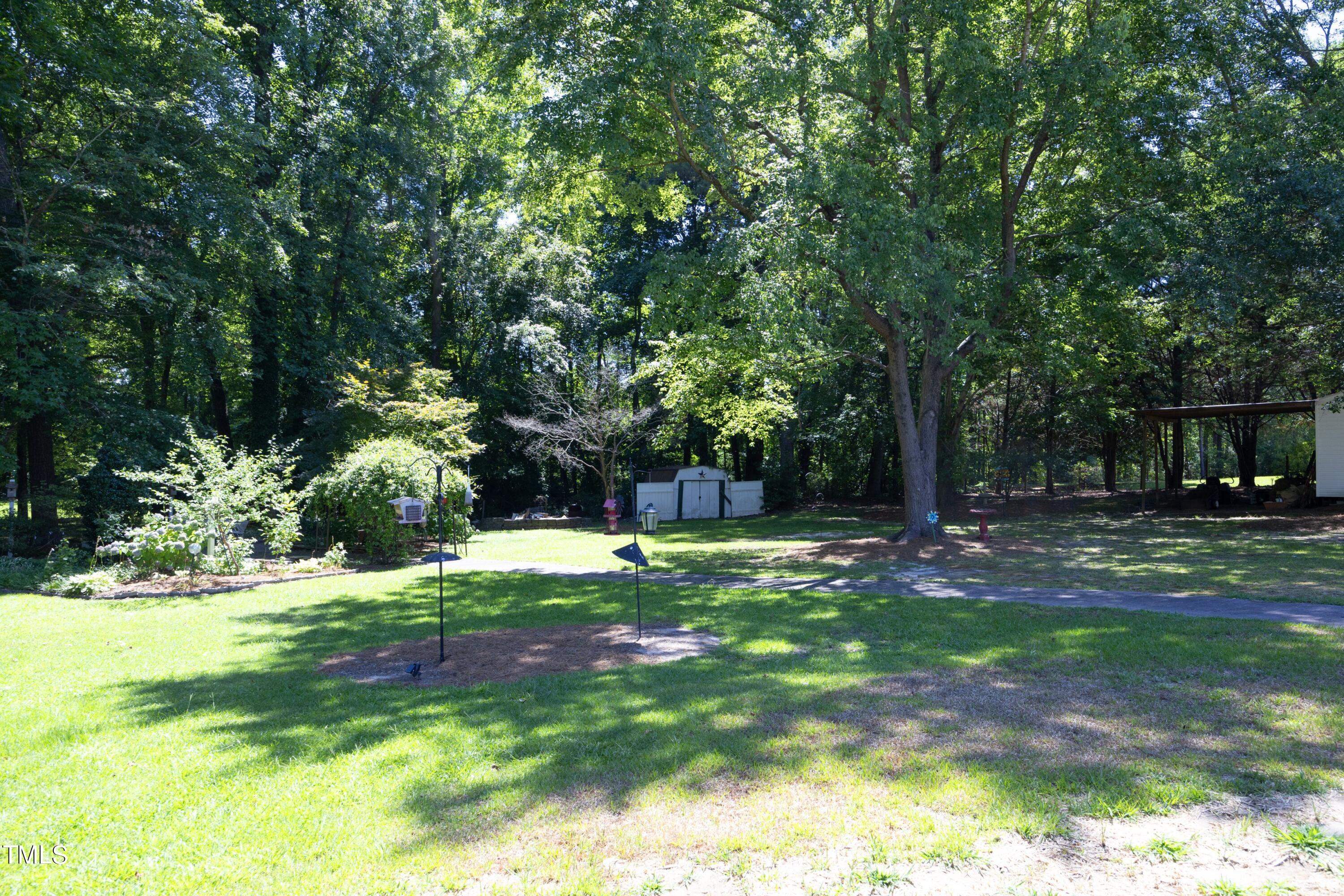 243 Bradley Drive Benson, NC 27504 - Photo 39 of 43 a fire hydrant in the middle of a field