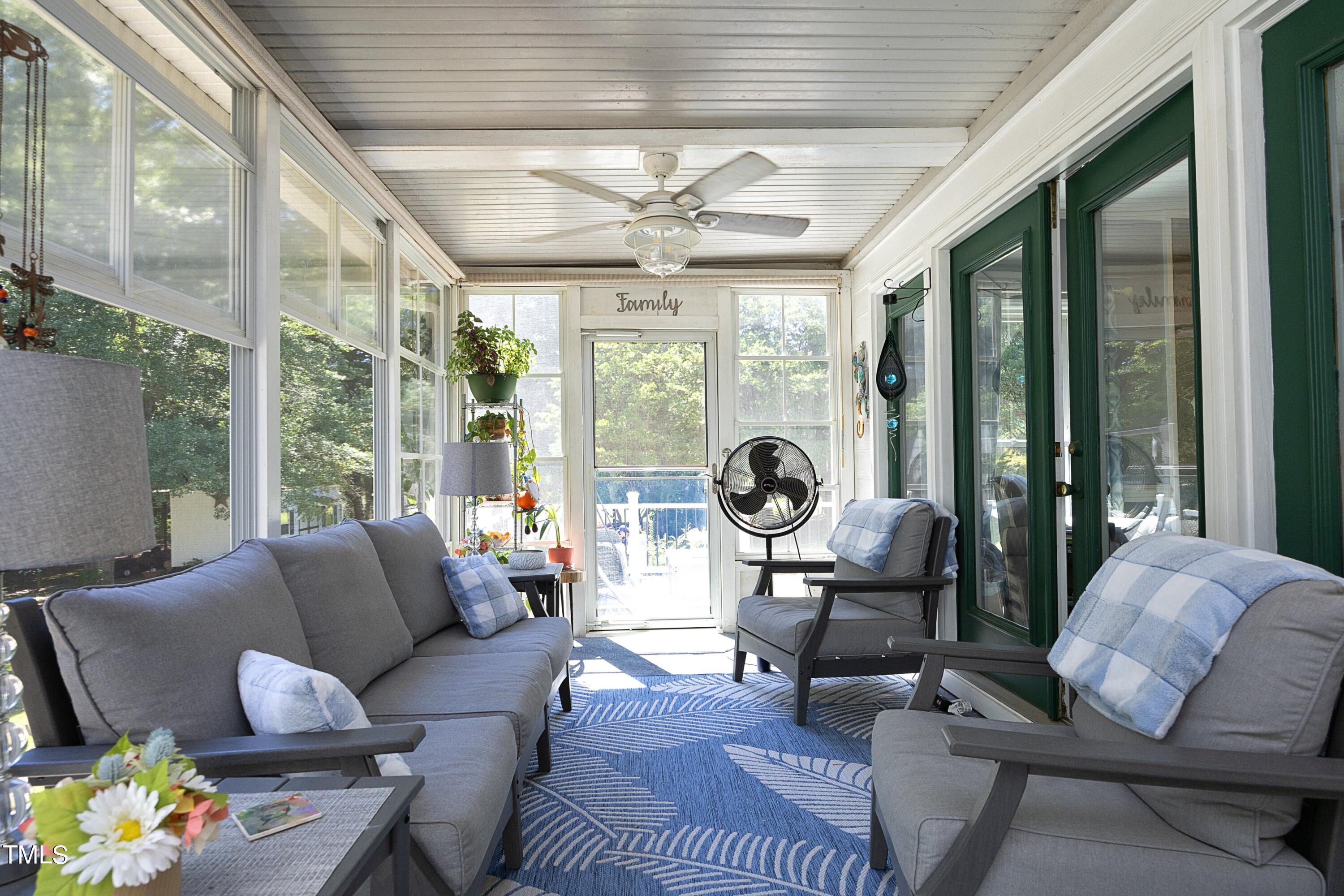 243 Bradley Drive Benson, NC 27504 - Photo 9 of 43 a living room with furniture and a large window