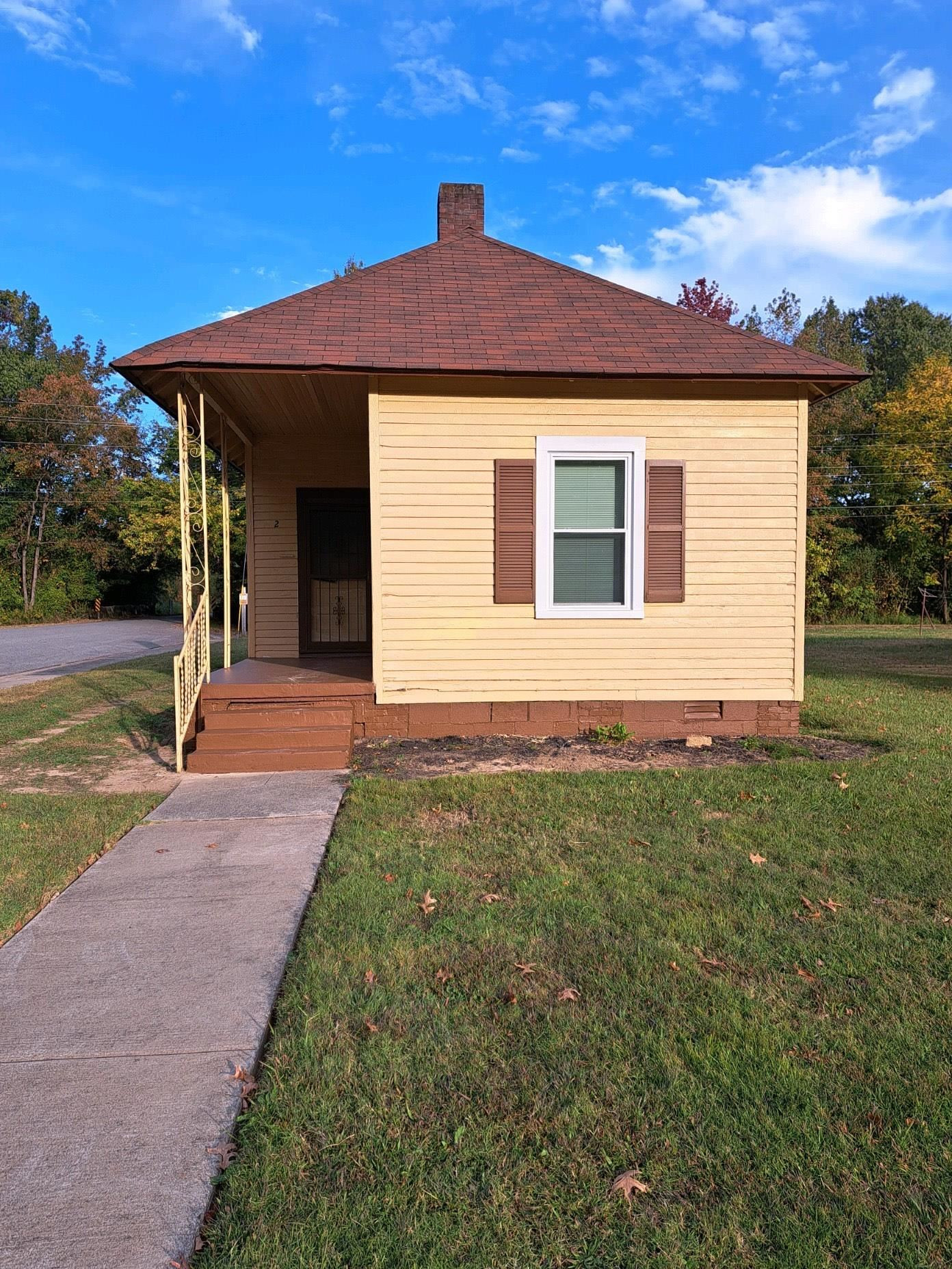 2 Butler Street Jackson, TN 38301 - Photo 1 of 7 a front view of a house with a yard
