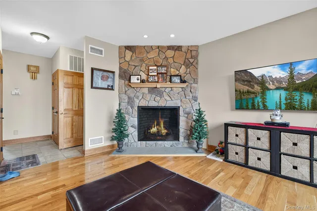 a view of a dining room with furniture and a flat screen tv