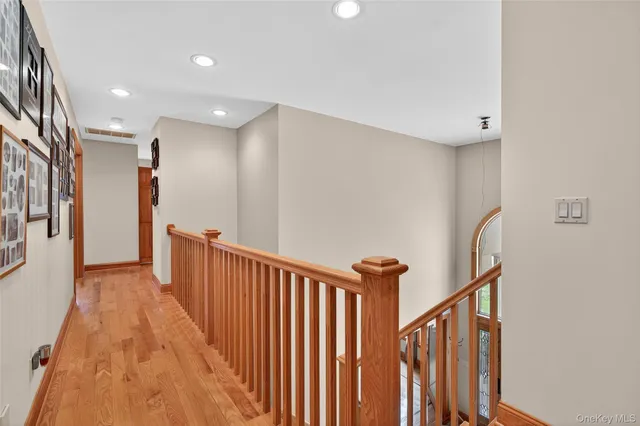 a bathroom with a glass shower door and a sink
