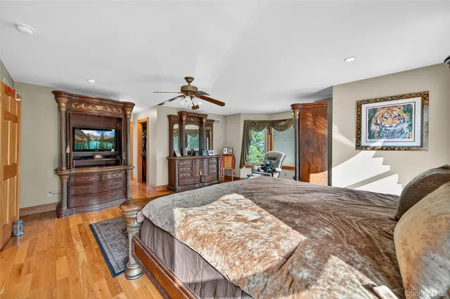 a bedroom with bed and a chandelier