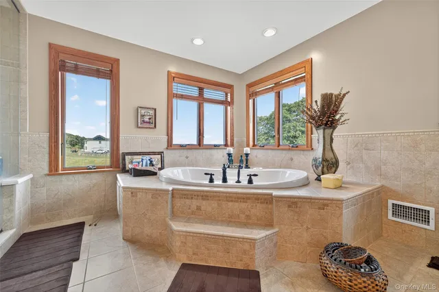 a utility room with fridge dryer and washer