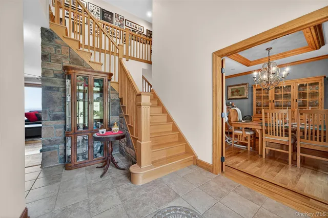 a view of a porch with chairs and a potted plant