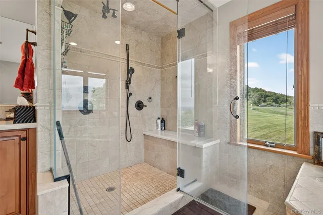 a bedroom with a bed dresser and a window