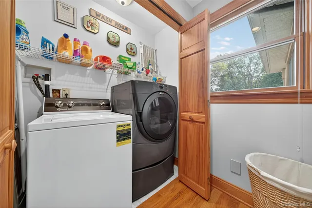 a dining hall with stainless steel appliances granite countertop a sink a stove and a refrigerator with wooden floor