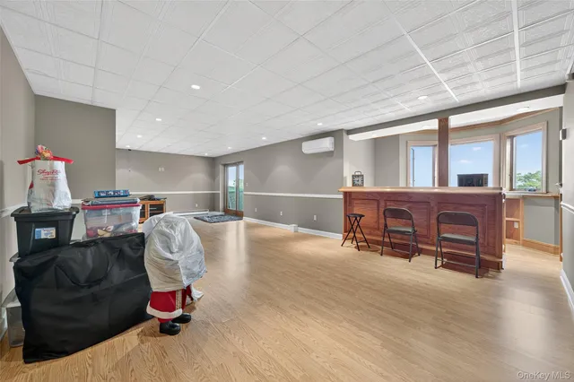 a kitchen with stainless steel appliances a refrigerator a sink and cabinets