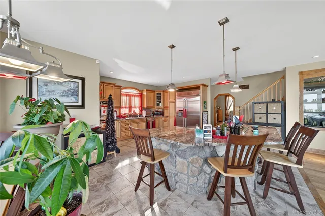 a bedroom with a balcony a bed and wooden floor