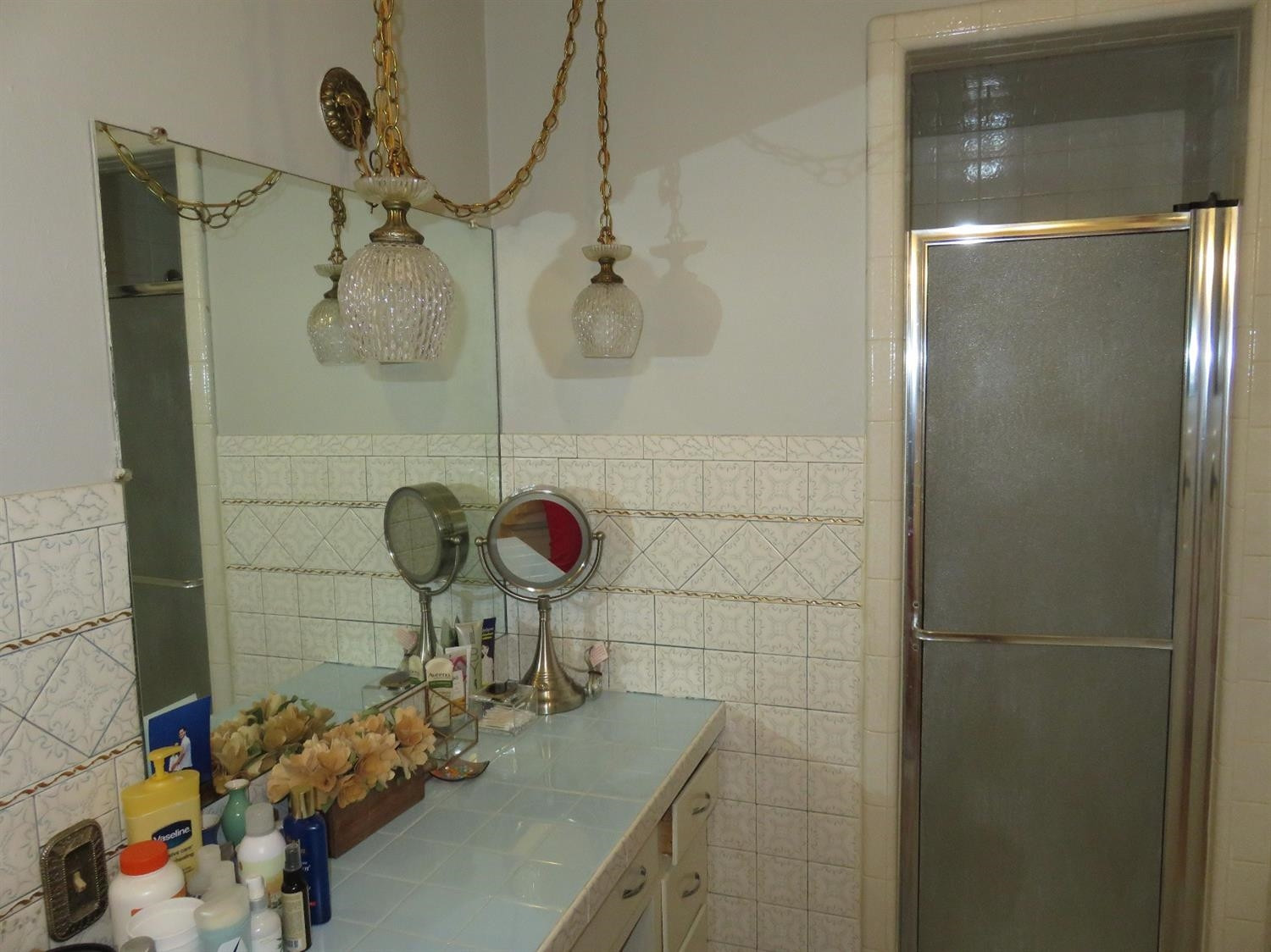 3706 41st Street Lubbock, TX 79413 - Photo 14 of 20 a bathroom with a sink and a shower