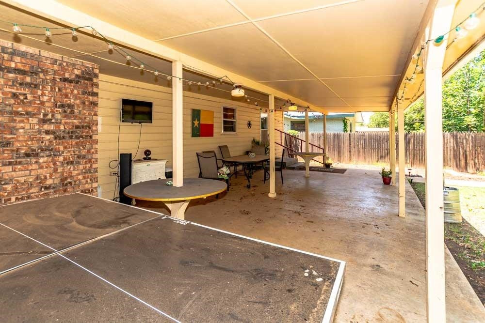 3706 41st Street Lubbock, TX 79413 - Photo 17 of 20 a backyard of a house with table and chairs
