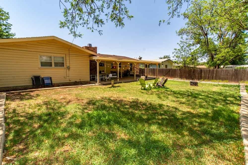 3706 41st Street Lubbock, TX 79413 - Photo 20 of 20 a view of a backyard with plants and patio