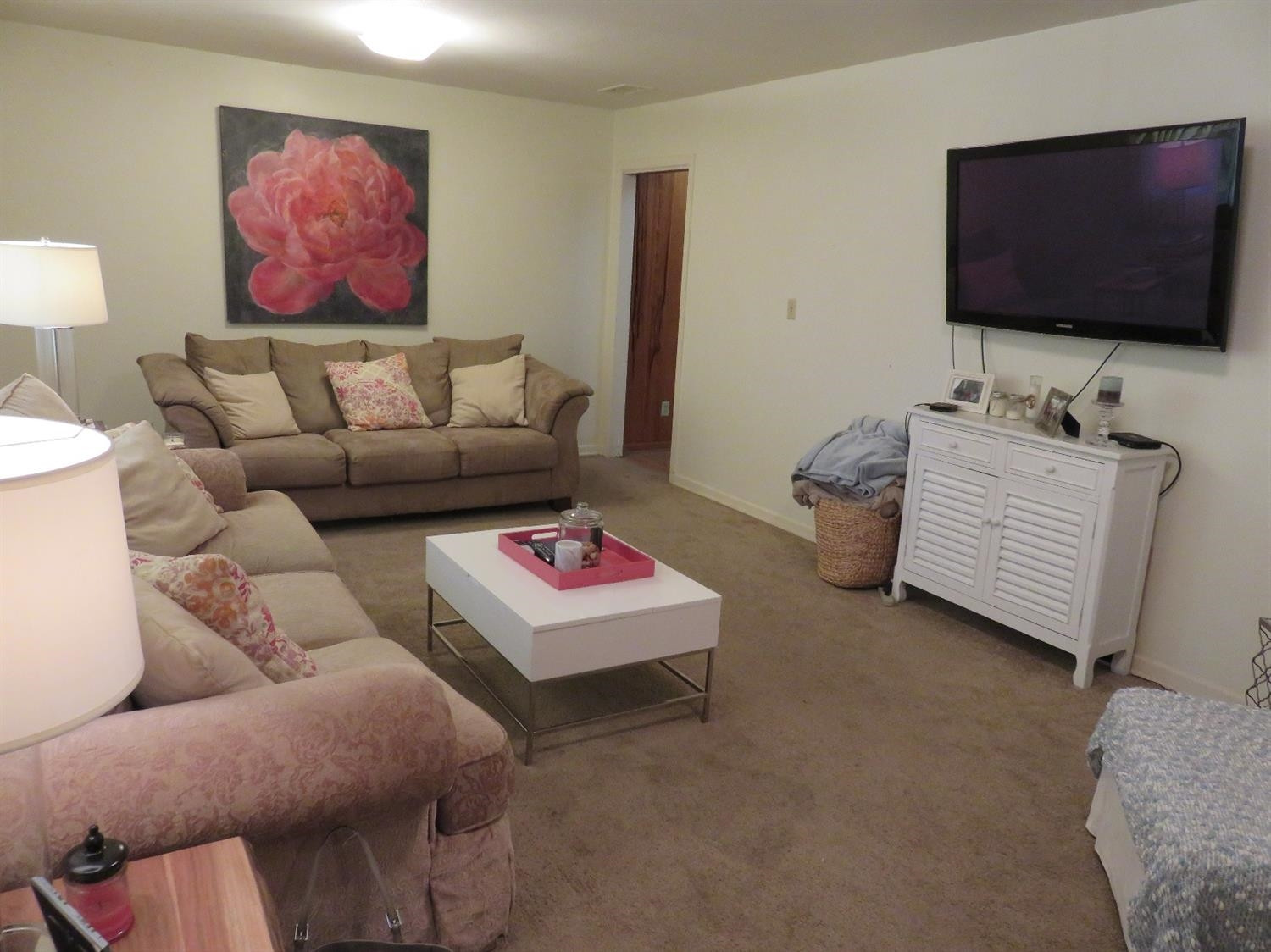 3706 41st Street Lubbock, TX 79413 - Photo 2 of 20 a living room with furniture and a flat screen tv