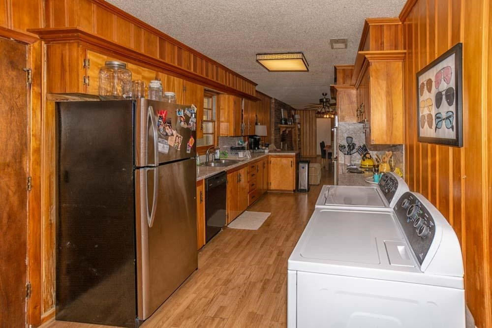 3706 41st Street Lubbock, TX 79413 - Photo 9 of 20 a view of a kitchen with a sink and dishwasher