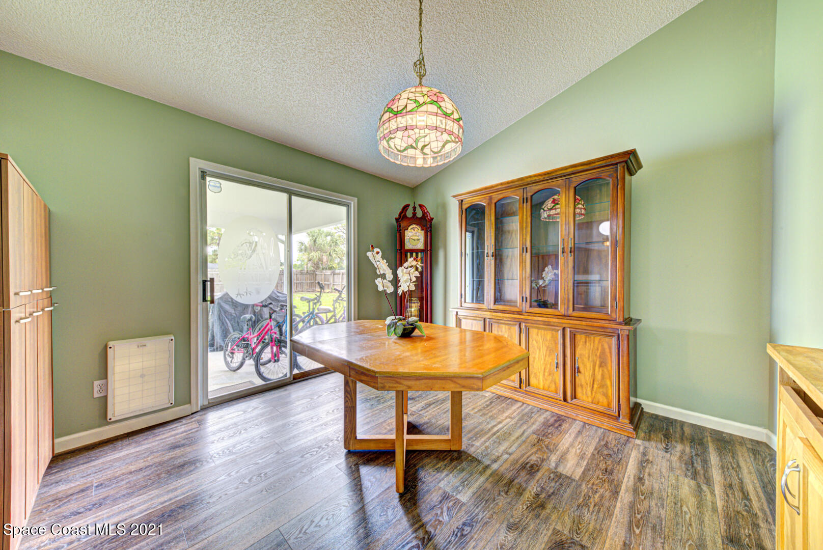 279 Rheine Road Northwest Palm Bay, FL 32907 - Photo 15 of 35 dining room with slider to patio