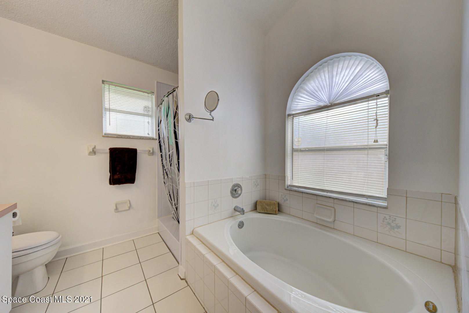 279 Rheine Road Northwest Palm Bay, FL 32907 - Photo 21 of 35 master bathroom shower & tub