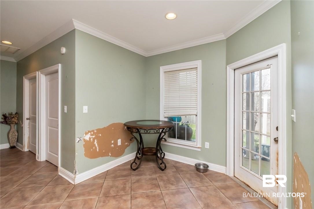 7170 Pierson Drive Mobile, AL 36619 - Photo 11 of 29 Tiled dining space with ornamental molding