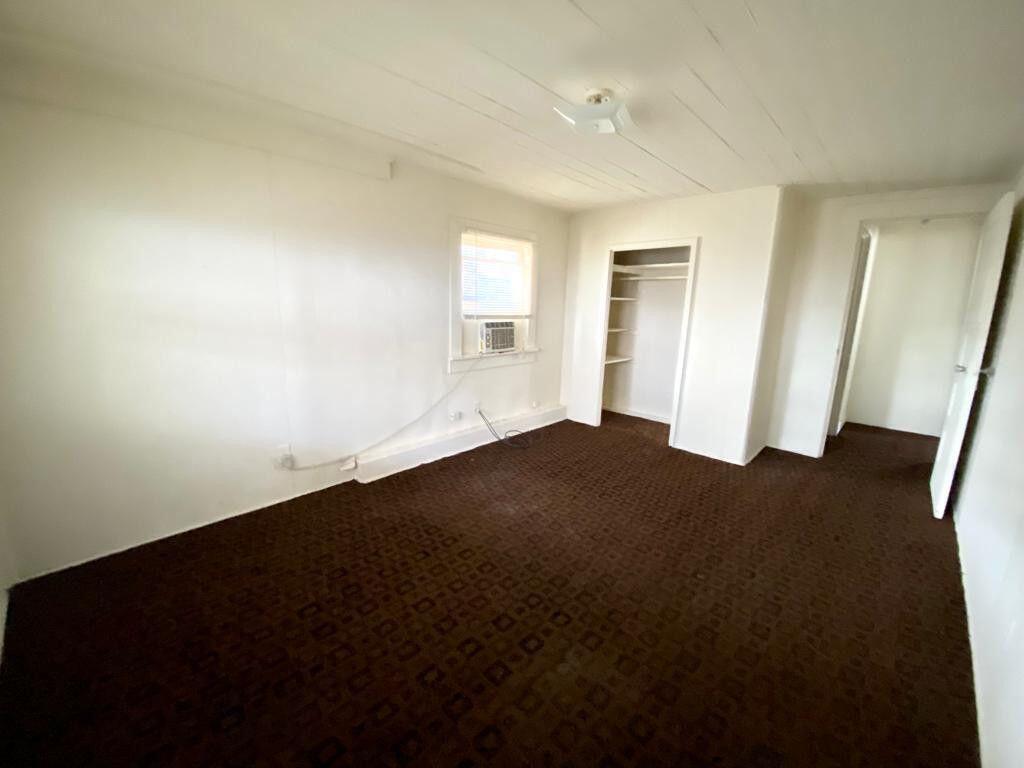 2105 Ponce De Leon Avenue, Unit 2 West Palm Beach, FL 33407 - Photo 7 of 8 an empty room with a window