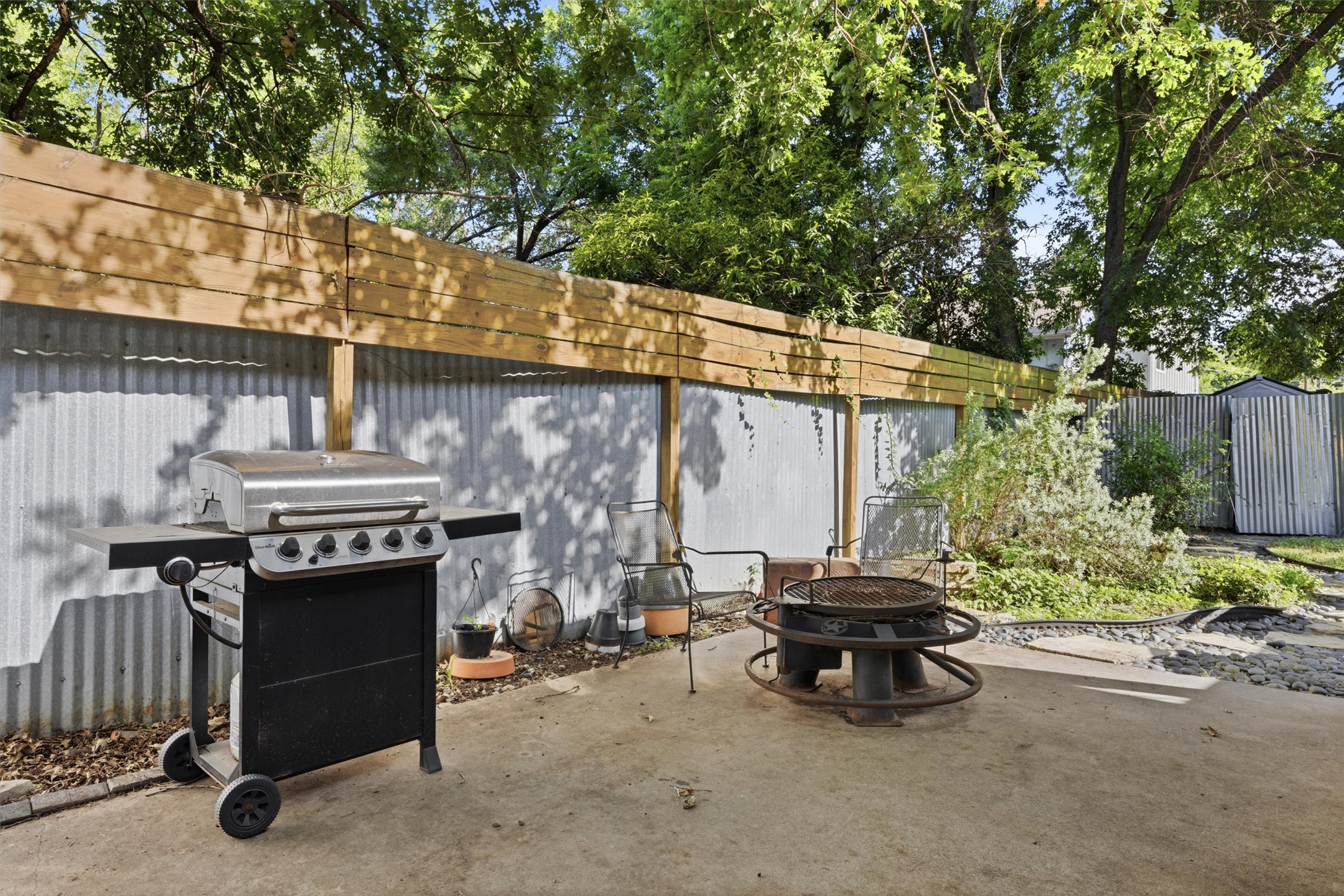 3015 Castro Street Austin, TX 78702 - Photo 30 of 40 Enjoy outdoor gatherings with a dedicated grilling area and fire pit, surrounded by a private, fenced yard.