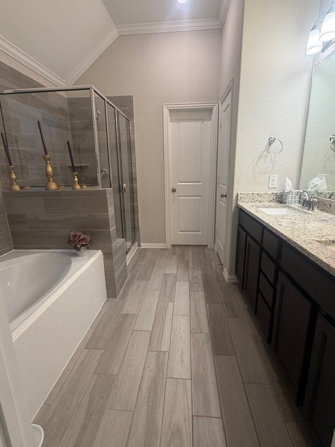 2136 Moss Creek Lane Conroe, TX 77304 - Photo 14 of 23 a bathroom with a sink a mirror and a bathtub