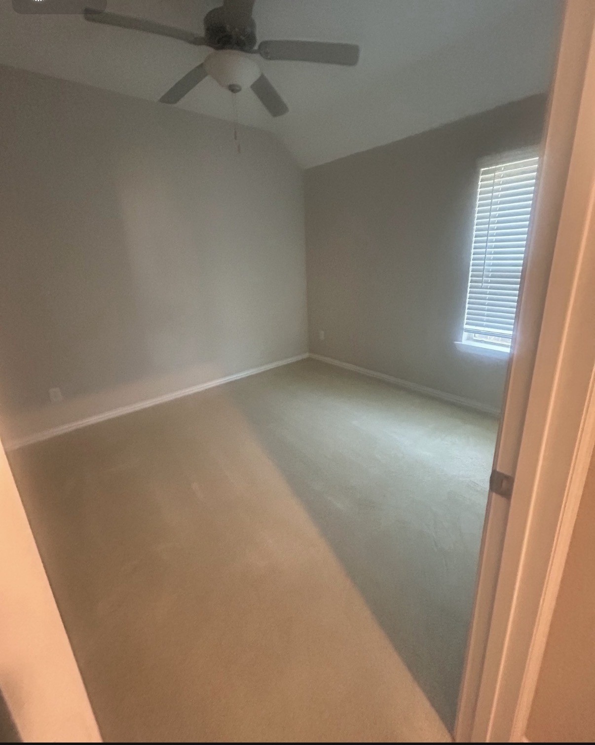 2136 Moss Creek Lane Conroe, TX 77304 - Photo 20 of 23 an empty room with a door
