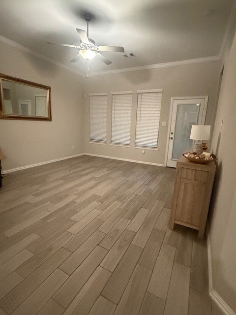 2136 Moss Creek Lane Conroe, TX 77304 - Photo 6 of 23 wooden floor in an empty room with a window