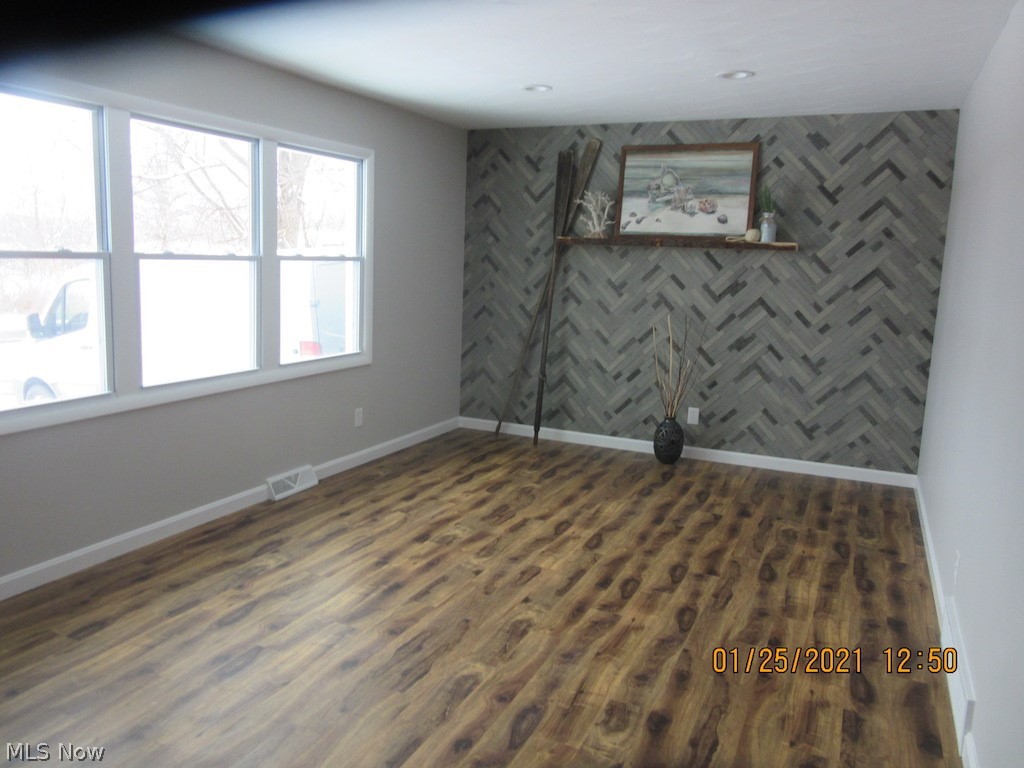 3749 Blackmore Road Perry, OH 44081 - Photo 3 of 25 living room w/ custom accent wall and large windows for natural light