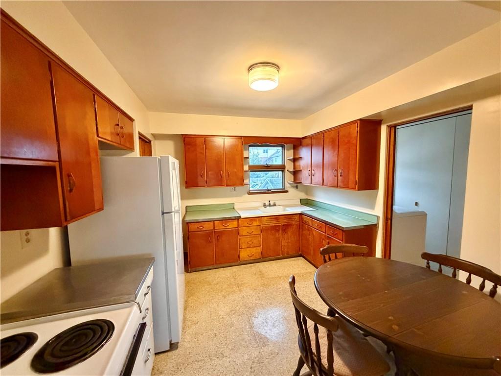 28 Union Street Uniontown, PA 15401 - Photo 4 of 9 a large kitchen with a table and chairs
