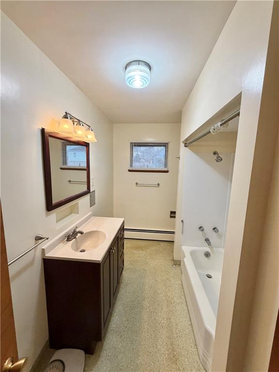 28 Union Street Uniontown, PA 15401 - Photo 8 of 9 a bathroom with a tub sink and mirror