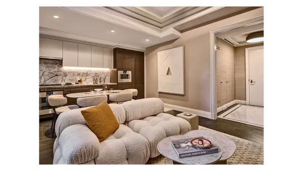 a living room with furniture and a rug