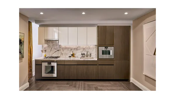 a kitchen with stainless steel appliances granite countertop a sink and cabinets