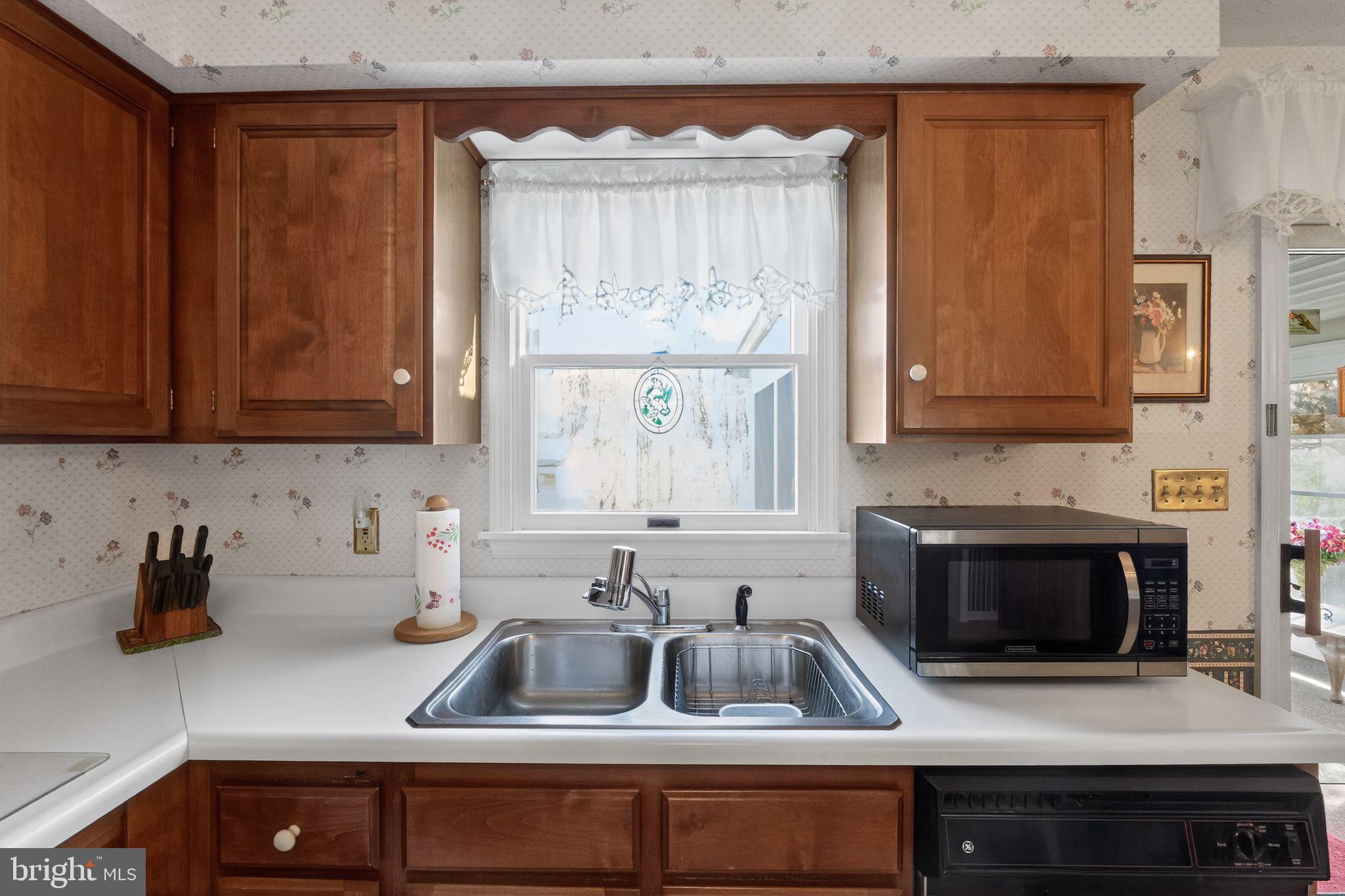 23 Crescent Lane Littlestown, PA 17340 - Photo 12 of 30 a kitchen with a sink and a microwave