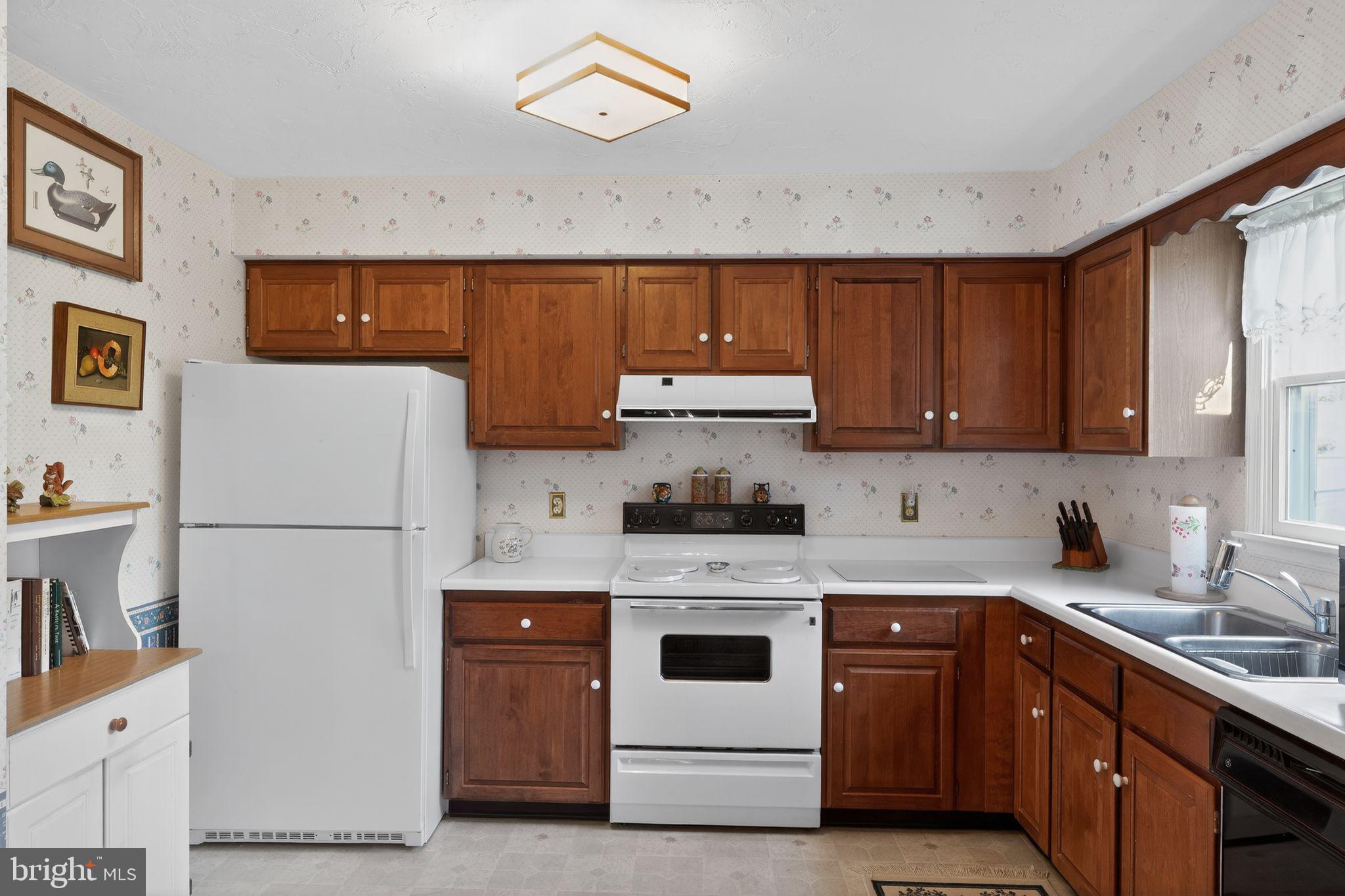 23 Crescent Lane Littlestown, PA 17340 - Photo 13 of 30 a kitchen with a white cabinets and white appliances