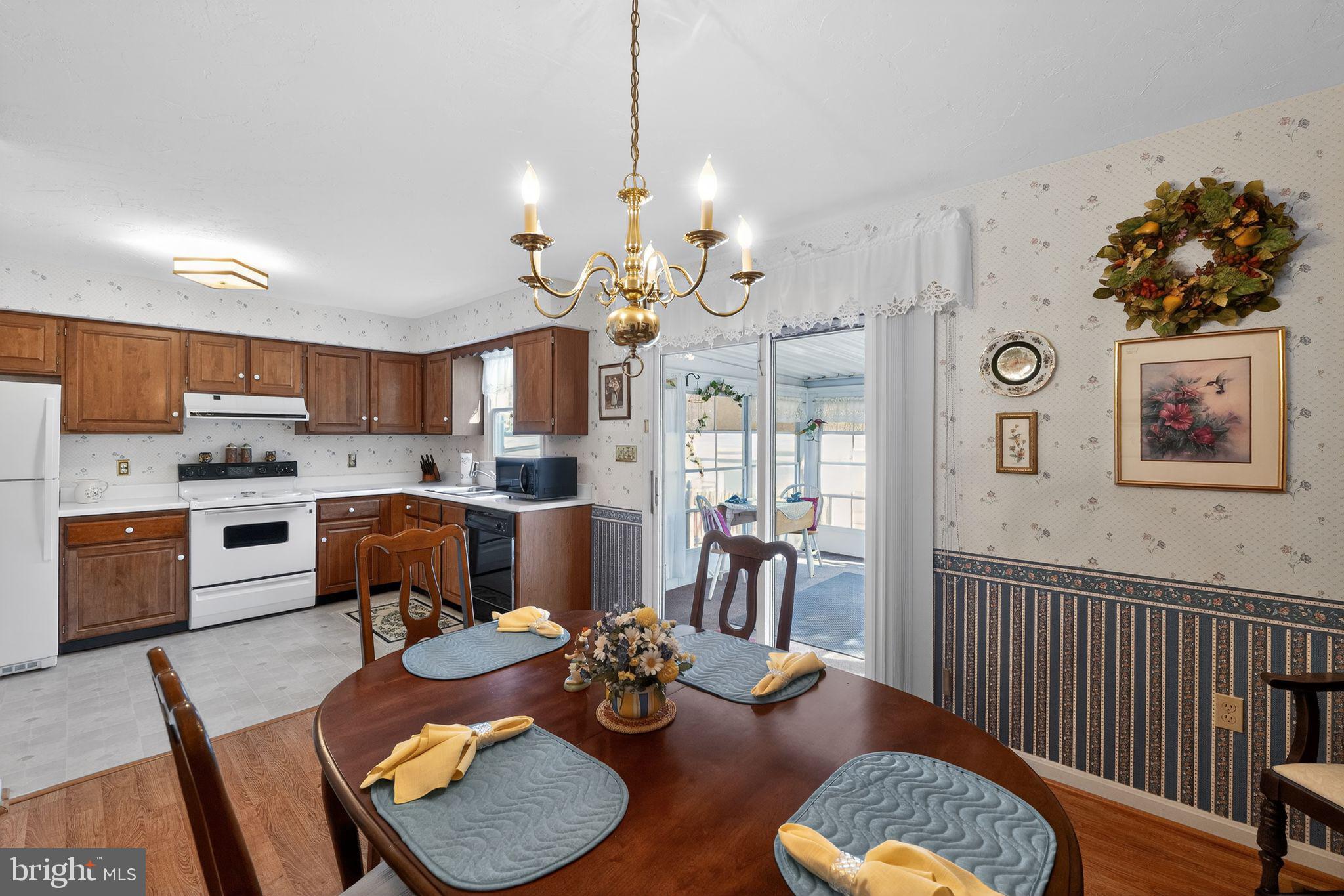 23 Crescent Lane Littlestown, PA 17340 - Photo 21 of 30 a living room with furniture kitchen view and a chandelier