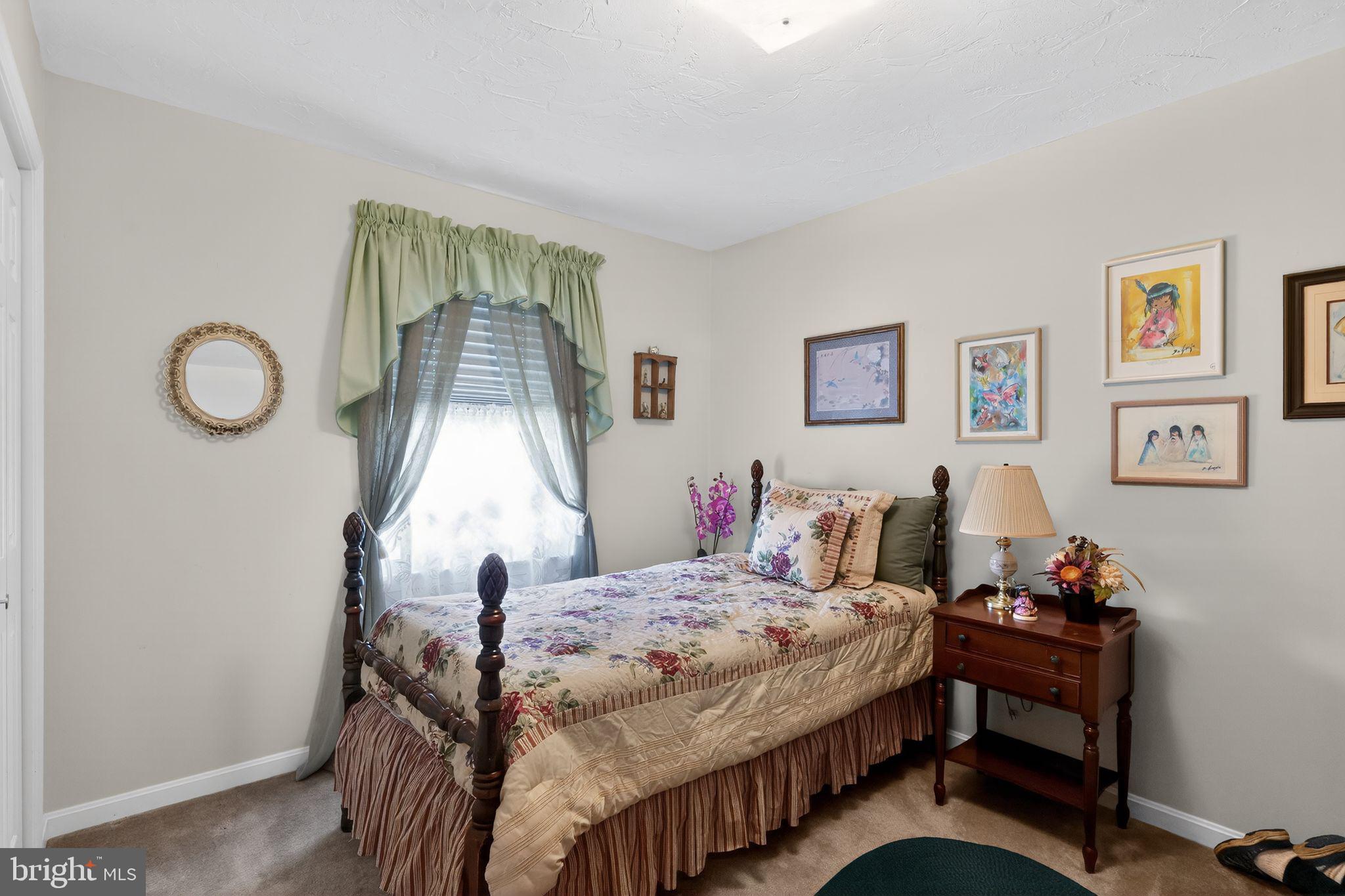 23 Crescent Lane Littlestown, PA 17340 - Photo 24 of 30 a bedroom with a bed and a window