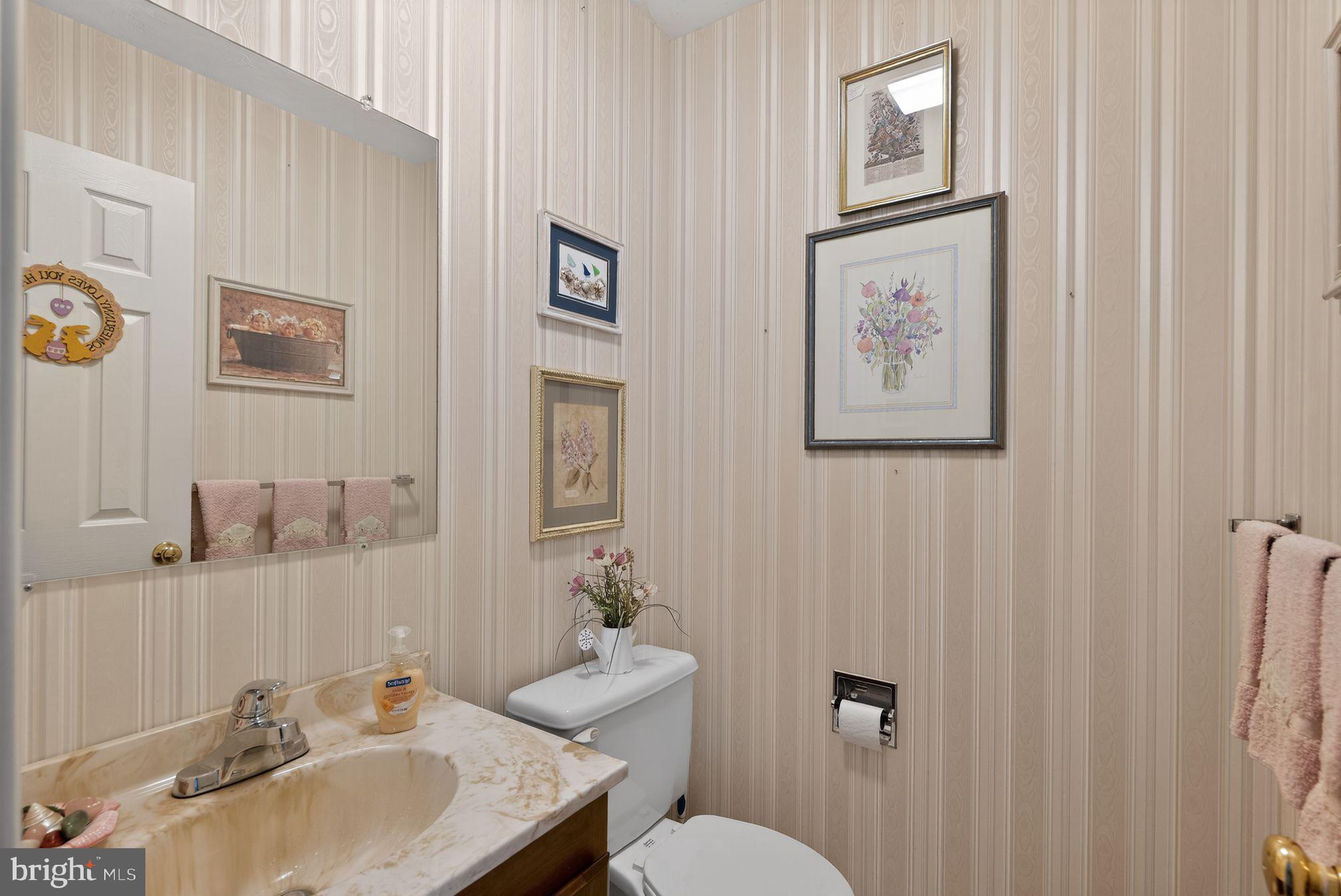 23 Crescent Lane Littlestown, PA 17340 - Photo 27 of 30 a bathroom with a toilet sink and mirror