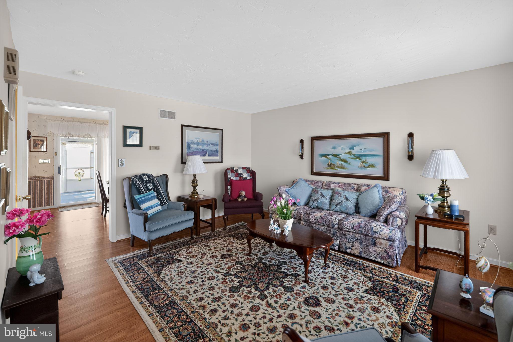 23 Crescent Lane Littlestown, PA 17340 - Photo 8 of 30 a living room with furniture and a rug