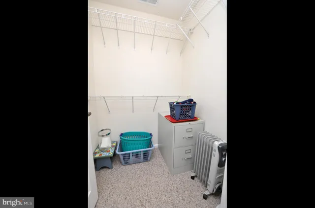 a view of a house with snow on the road