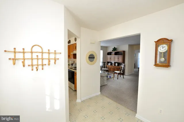 a view of a livingroom with furniture and front door