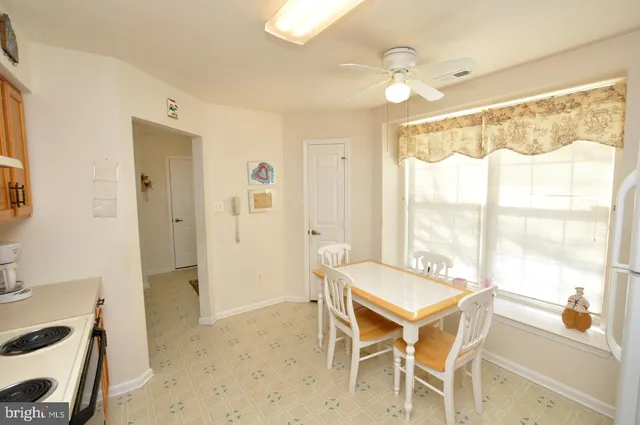 a living room with a large window and table