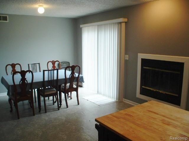 3654 South Merriman Road Wayne, MI 48184 - Photo 5 of 26 Dining Area w/ Fireplace & Patio Door.