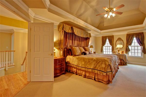 6 Chadwick Way Hopkinton, MA 01748 - Photo 17 of 30 a spacious bedroom with a bed and a chandelier