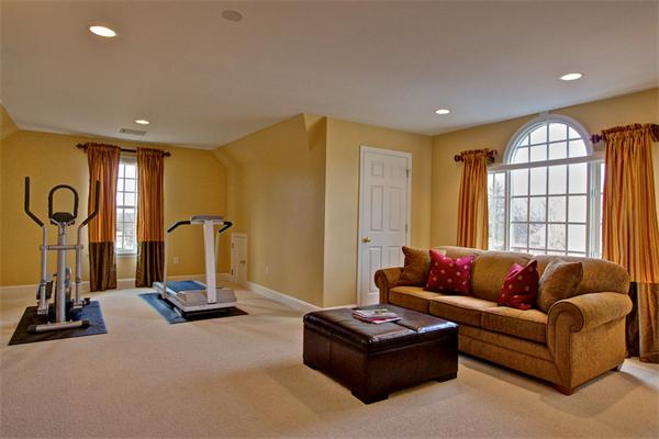 6 Chadwick Way Hopkinton, MA 01748 - Photo 18 of 30 a living room with furniture a window and gym equipment