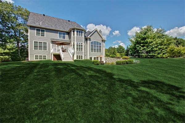 6 Chadwick Way Hopkinton, MA 01748 - Photo 2 of 30 a front view of a house with a garden