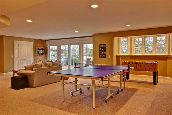 6 Chadwick Way Hopkinton, MA 01748 - Photo 24 of 30 a living room with furniture a flat screen tv and a large window