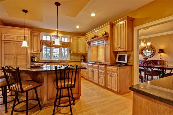 6 Chadwick Way Hopkinton, MA 01748 - Photo 3 of 30 a kitchen with stainless steel appliances granite countertop table chairs stove and granite counter top